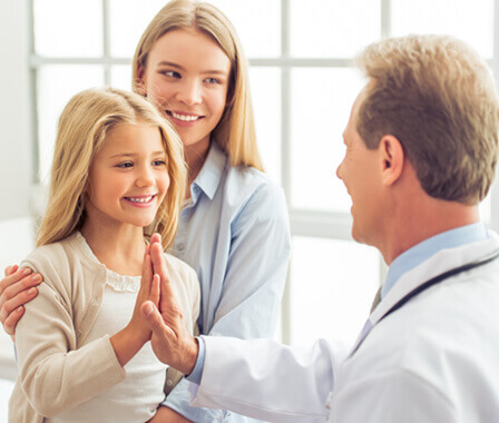 Child giving doctor a high five