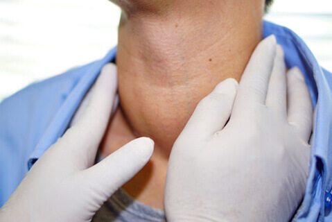Man having lump on neck examined by doctor